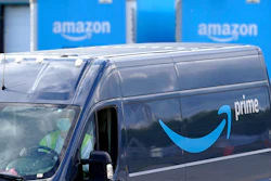 A delivery van departs an Amazon warehouse in Dedham, Mass., Oct. 1, 2020.