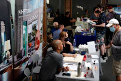 Prospective employers and job seekers interact during during a job fair in West Hollywood, Los Angeles, Sept. 22, 2021.