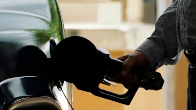 A customer pumps gas at a Sam's Club location in Madison, Miss., May 24, 2022.