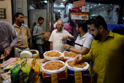 Retailers shop for dry fruits in a wholesale market, New Delhi, Oct. 10, 2022.
