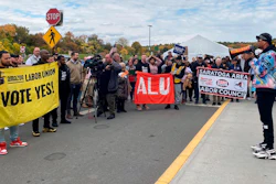 Chris Smalls, right, the head of the Amazon Labor Union, speaks to Amazon workers and supporters at a rally in Castleton-On-Hudson, N.Y., Oct. 10, 2022.