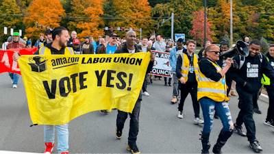 Amazon workers and supporters march during a rally in Castleton-On-Hudson, about 15 miles south of Albany, N.Y., Monday, Oct. 10, 2022.