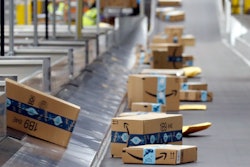 Packages move along a conveyor at an Amazon warehouse, Goodyear, Ariz., Dec. 17, 2019.