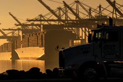 A truck arrives to pick up a shipping container near vessels at the Port of Los Angeles, on Nov. 30, 2021. An influential government advisory panel comprised of major U.S. businesses is proposing new rules that would roll back already limited public access to import data, a move that trade experts say would make it harder to trace labor abuse by foreign suppliers. The proposal, if adopted, would shroud in secrecy customs data on ocean-going freight responsible for about half of the $2.7 trillion worth of goods entering the U.S. every year in the same way it already is for rail, truck and air cargo.