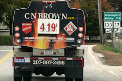 A fuel delivery truck advertises its price for a gallon of heating oil, Livermore Falls, Maine, Oct. 5, 2022.