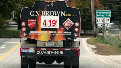 A fuel delivery truck advertises its price for a gallon of heating oil, Livermore Falls, Maine, Oct. 5, 2022.