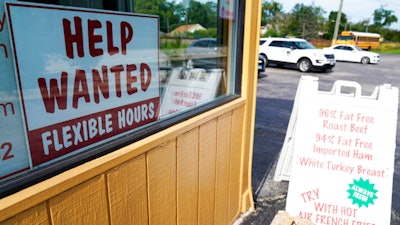A help wanted sign is displayed in Deerfield, Ill., Sept. 21, 2022.