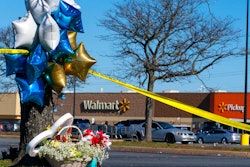 Flowers and balloons have been placed near the scene of a mass shooting at a Walmart, Wednesday, Nov. 23, 2022, in Chesapeake, Va. A Walmart manager opened fire on fellow employees in the break room of the Virginia store, killing several people in the country’s second high-profile mass shooting in four days, police and witnesses said Wednesday.