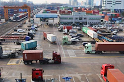 Container trucks run at the Inland Container Depot in Uiwang, South Korea, Dec. 9, 2022.