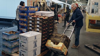 People shop for fruits and vegetables at S. Katzman Produce, Hunts Point Produce Market, the Bronx, Nov. 22, 2022.