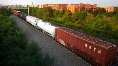A CSX freight train travels through Alexandria, Va., Sept. 15, 2022. Shippers praised the proposed changes federal regulators approved Monday, Dec. 19, to the system they use to dispute the rates railroads charge because the current system is so costly and cumbersome that it is little used.
