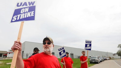 Members of United Auto Workers Local 807 picket after going on strike, May 2, 2022, at a CNH plant in Burlington, Iowa. More than 1,000 striking CNH Industrial workers in Iowa and Wisconsin will soon vote on an offer from the maker of construction and agricultural equipment for the first time since they walked off the job eight months ago. The UAW union said it would schedule a vote on the company’s latest upgraded offer but it did not release any details of what is included in the offer.
