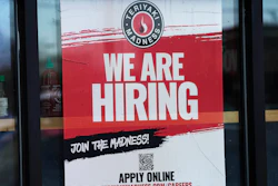 A hiring sign displayed at a restaurant in Rolling Meadows, Ill., Jan. 30, 2023.