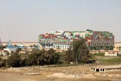 The Ever Given, a Panama-flagged cargo ship, is wedged across the Suez Canal, in Amer, Egypt, March 28, 2021.