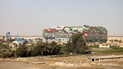 The Ever Given, a Panama-flagged cargo ship, is wedged across the Suez Canal, in Amer, Egypt, March 28, 2021.