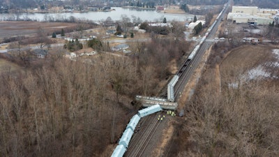 An emergency crew works at the site of a Norfolk Southern train derailment in Van Buren Township, Mich., Feb. 16, 2023.