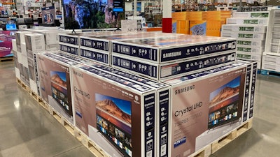Big-screen televisions displayed in a Costco warehouse, Sheridan, Colo., Feb. 21, 2023.