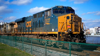 A CSX freight train sits on a siding in downtown Pittsburgh, Nov. 19, 2022. CSX railroad has promised to give more of its workers the paid sick time they demanded in contract negotiations last fall. CSX is the only major freight railroad so far to agree to give its employees sick time in the wake of the contentious negotiations that ended only after Congress stepped in to block a potential strike.