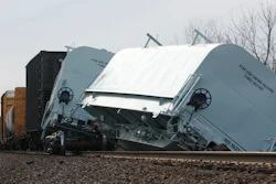 A Norfolk Southern cargo train car leans off the tracks after derailing in Clark County, Ohio, March 4, 2023.