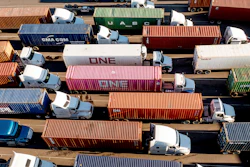 Trucks line up to enter a Port of Oakland shipping terminal, Nov. 10, 2021, Oakland, Calif.