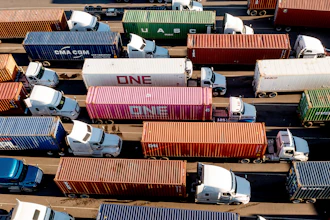 Trucks line up to enter a Port of Oakland shipping terminal, Nov. 10, 2021, Oakland, Calif.