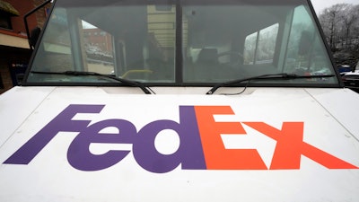 A FedEx truck makes deliveries in Mount Lebanon, Pa., Jan. 23, 2023.