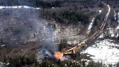 Several locomotives and rail cars burn after a freight train derailed near Rockwood, Maine, April 15, 2023.