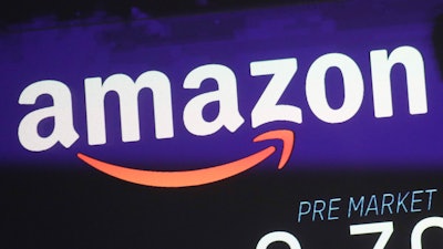 The price of Amazon stock is shown on a screen at the Nasdaq MarketSite, New York, Dec. 20, 2017.