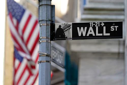 Flags adorn the facade of the New York Stock Exchange, June 16, 2021.
