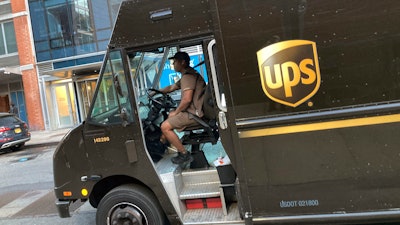 A United Parcel Service driver pilots his truck, in New York, Thursday, May 11, 2023.