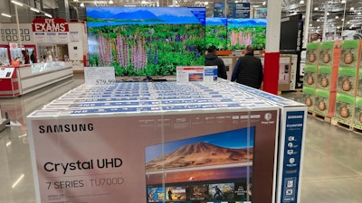 A display of big-screen televisions in a Costco warehouse, April 26, 2023, Sheridan, Colo.