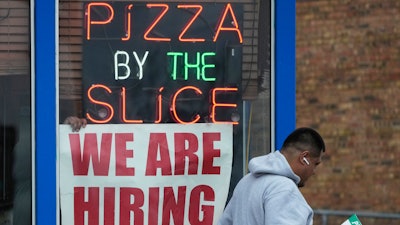 A hiring sign displayed at a restaurant in Prospect Heights, Ill., April 4, 2023.