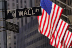 Flags fly outside the New York Stock Exchange, Sept. 23, 2022.