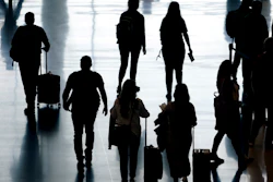 Travelers pass through Salt Lake City International Airport, June 27, 2022.