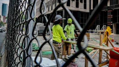 Construction workers work with rebar at a site in New York, June 6, 2023.