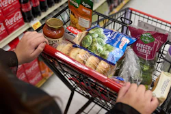 A shopper pushes a cart of groceries at a supermarket in Bellflower, Calif., Feb. 13, 2023.