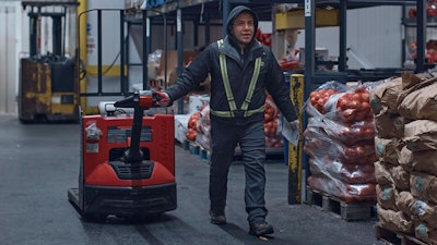 A man maneuvers a lift at S. Katzman Produce at the Hunts Point Produce Market, the Bronx, New York, Nov. 22, 2022.