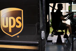 United Parcel Service driver Hudson de Almeida steers through a neighborhood in Haverhill, Mass., June 30, 2023.