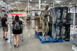 Shoppers pass a display of Halloween goods in a Costco warehouse, Thornton, Colo., Aug. 4, 2023.