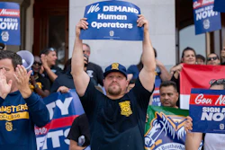 Teamsters union members hold signs urging California Gov. Gavin Newsom to sign Assembly Bill 316 in Sacramento, Sept. 19, 2023.