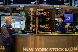 Traders work at their stations at the New York Stock Exchange, May 26, 2023.