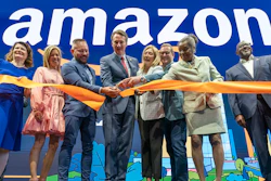 Virginia Gov. Glenn Youngkin, center, with Holly Sullivan, Vice President of Economic Development at Amazon, center right, cut the ribbon during a grand opening ceremony at Amazon's second headquarters, HQ2, in Arlington, Va., June 15, 2023.