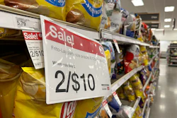 A sale sign hangs below a shelf of potato chips in a Target store in Sheridan, Colo., Oct. 4, 2023.