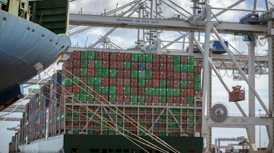 In this photo provided by the Georgia Ports Authority, a vessel is loaded with containers by a ship to shore crane at the Georgia Ports Authority's Port of Savannah Garden City Terminal, on Oct. 21, 2021, in Savannah, Ga.