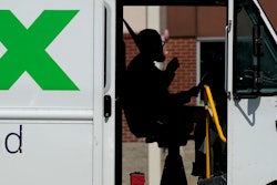 A FedEx driver makes deliveries in Palatine, Ill., Wednesday, Sept. 13, 2023. On Friday, the U.S. government issues its latest monthly jobs report.
