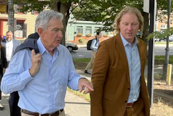 Federal Reserve Chair Jerome Powell, left, and Kevin Schreiber, CEO of the York County Economic Alliance, walk in York, Pa. on Monday, Oct. 2, 2023. Powell met with workers, employers and community leaders in York regarding efforts to strengthen the local economy.
