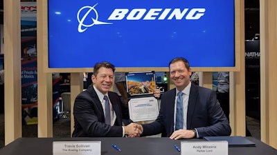 Travis Sullivan (left), vice president and general manager of Boeing Distribution, and Andy Winzenz, NHV, global general manager, Parker Lord.