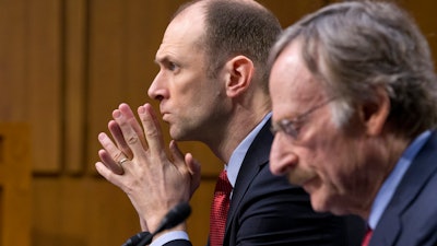Austan Goolsbee, left, then-chairman of the Council of Economic Advisers, testifies on Capitol Hill, Feb. 28, 2013.
