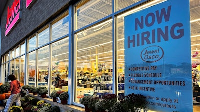 A hiring sign is displayed at a Jewel Osco store, Deerfield, Ill., Oct. 5, 2023.