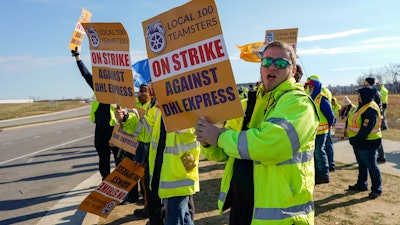 Teamsters protest near the DHL Express Hub at Cincinnati/Northern Kentucky International Airport, Erlanger Ky., Dec. 8, 2023.